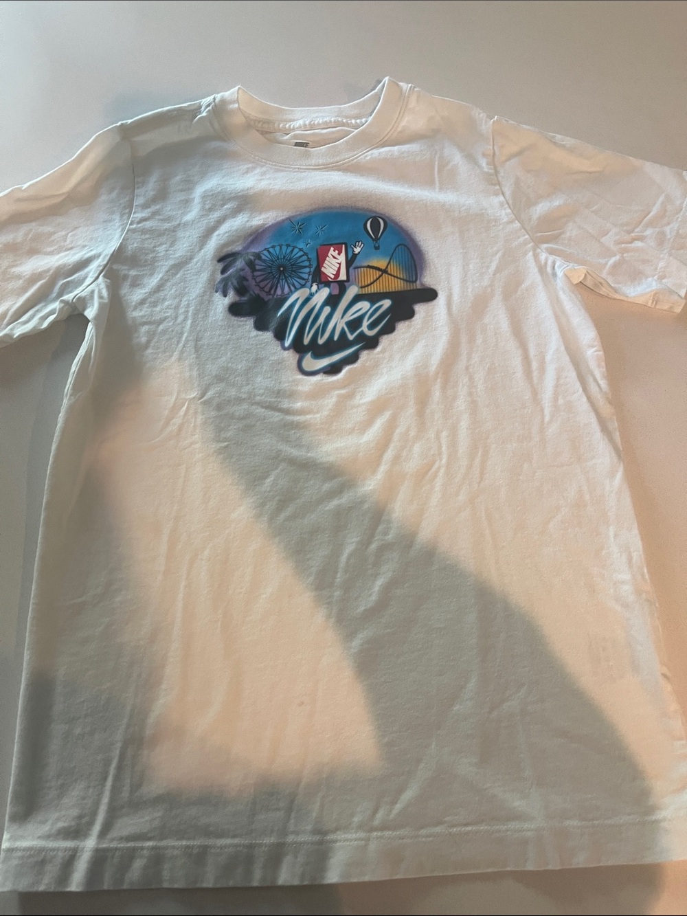 Nike White Shirt Sleeve T-Shirt with Colorful Coastal Graphic